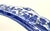 Decorative blue-and-white transferware wall rack in the classic Blue Willow pattern featuring pagodas, birds, and...