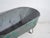 Industrial galvanized-metal storage container, most likely a farm trough or service reservoir, originally from central...