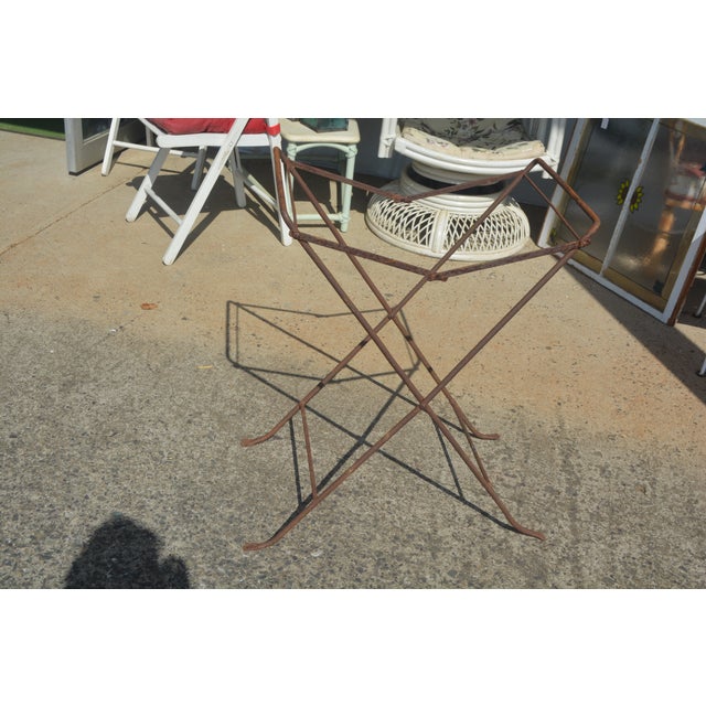 This rustic table/tray has been around a long time. The base looks like it folds, but I cannot get it to & did not want to...