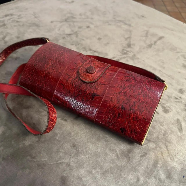 Step into the world of retro glamour with this stunning Vintage Textured Red Leather Shoulder Bag, crafted in the late...