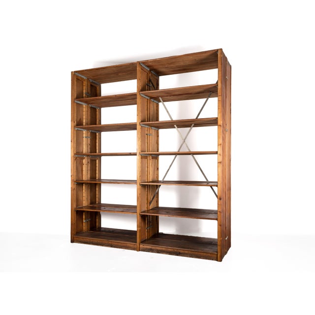 A unique pine shelving unit from the 1920s; the frame components and shelves are crafted from softwoods (spruce/fir),...