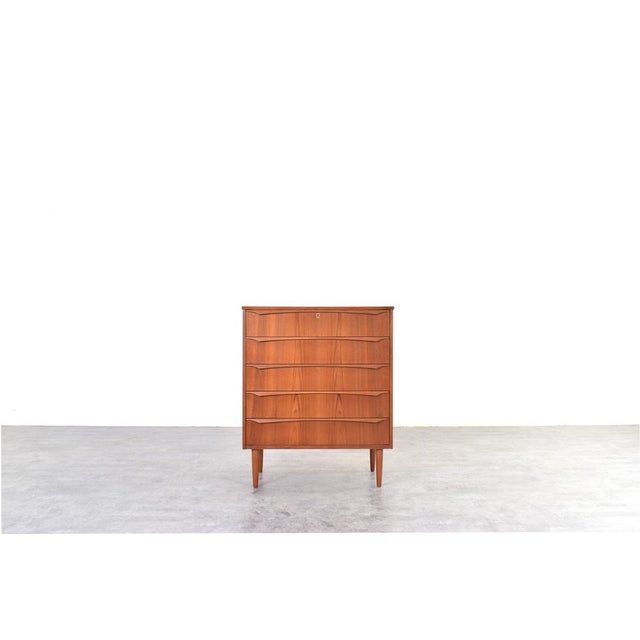 This Danish chest of drawers from the 1960s is an example of Mid-Century Modern design, which emphasized proportion,...