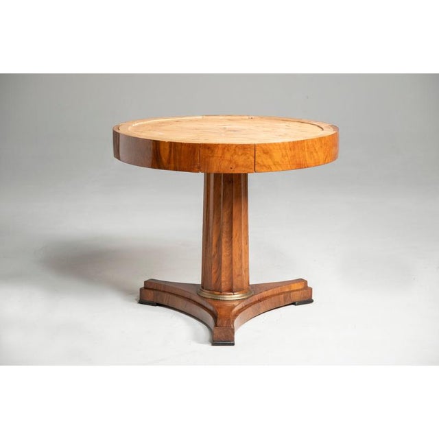A round table from the Lombard Empire period, made of veneered walnut with an original Bardiglio marble top. All 4 drawers...