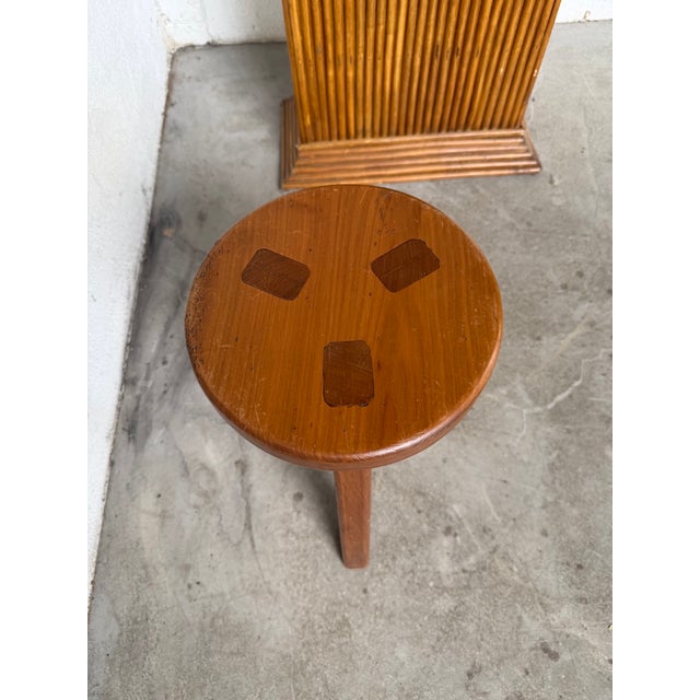 Antique tripod stool in solid gilt elm. We love its overall look, its subtly elegant tripod base, and the way the base is...
