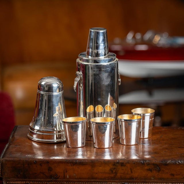 20th Century British silver plated cocktail shaker, of large proportions, the body acting as a shaker, with four gilt-...