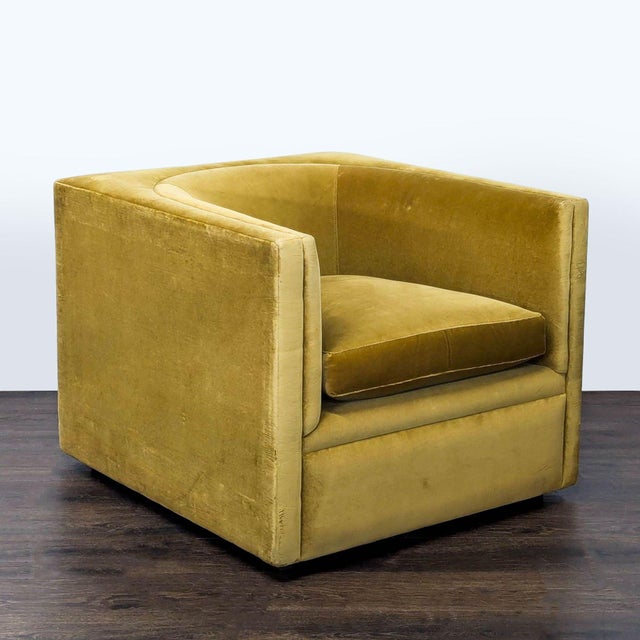 This lounge chair features a cozy, boxy design with soft mustard yellow velvet upholstery. Perfect for any living room or...