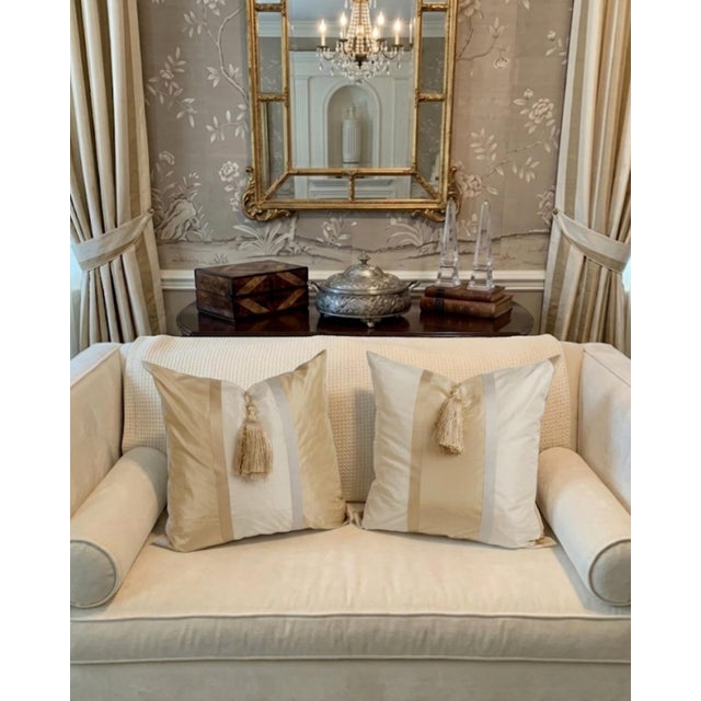 A beautifully crafted pair of 22-inch couture‑inspired decorative pillows in a silk‑like champagne satin jacquard. The...