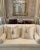 A beautifully crafted pair of 22-inch couture‑inspired decorative pillows in a silk‑like champagne satin jacquard. The...