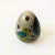 A vintage tonala pottery egg. Made in Mexico, with beautiful hand painted designs. One side features a yellow bird and on...