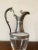 Very nice ewer, carafe from the early 20th century. The body is made of smooth glass while the foot, handle and spout are...