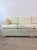 This postmodern three seater sofa features vintage white patterned upholstery with removable cushions and unique oversized...