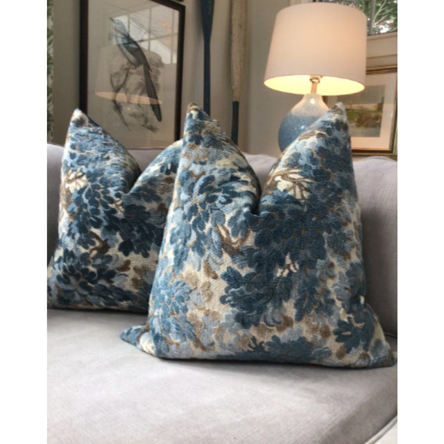 Covered in a rich fabric by famed design house Cowtan and Tout, "Walden" in color Delft is a plush blue raised velvet...