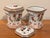 A pair of striking floral Chinese porcelain potpourri jars. The jars are square or octagonal with a pair of handles and a...