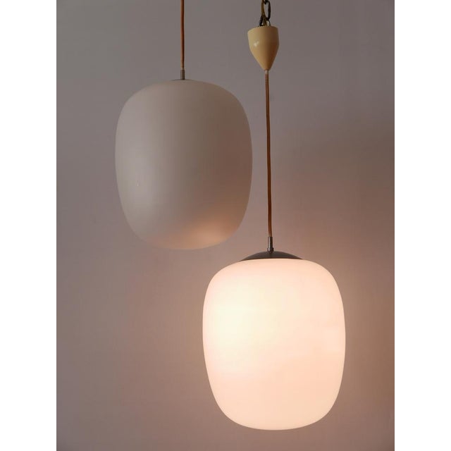 Elegant mid-century modern pendant lamp or hanging light. Model 'düren'. Designed by wilhelm wagenfeld for peill &...