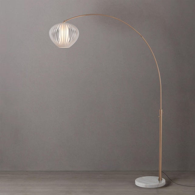 The Float Arc Lamp is a striking arc lamp featuring a weathered brass steel body and a sphere white satin steel shade. Its...