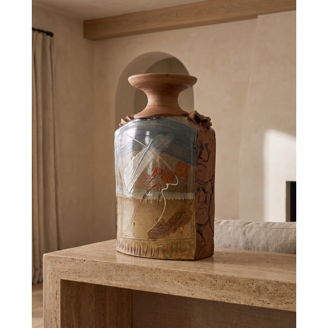 This large-scale terracotta studio pottery vase combines a strong architectural form with richly varied surface...