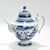A fine antique Chinese Export porcelain tea pot. In the Canton pattern. Decorated in underglaze blue with a mountainous...