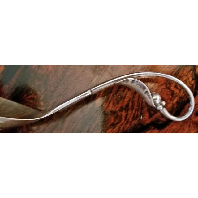Circa 1945. Beautifully cast sterling silver caddy sppon or sometimes referred to as a berry spoon, by the World Renowned...