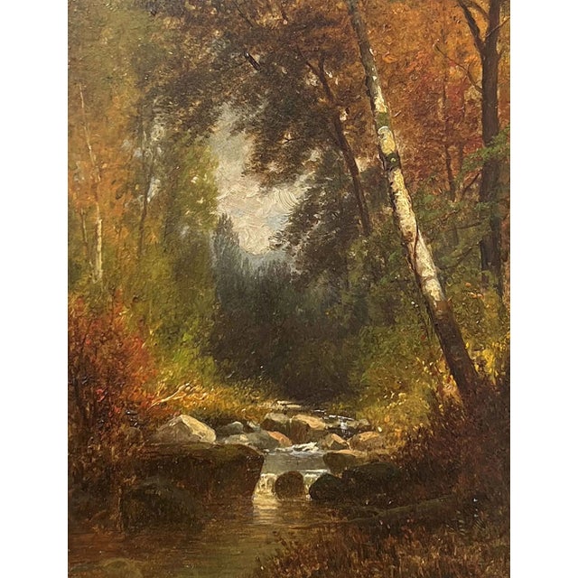Adirondack Stream in Fall by Hudson River School artist Joseph Antonio Hekking (1830-1903) is oil on board and measures 8...
