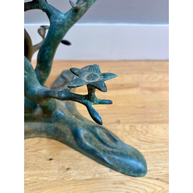 A verdigris finish bronze organic and naturalistic cocktail table by Willy Daro. The base of branches and leaves with two...