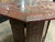 A small octagonal side table with arched apron panels and a top fully hand painted with flowers, scrolls and a central...