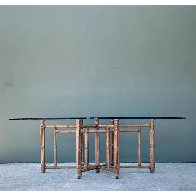 Showcasing the celebrated craftsmanship of McGuire Furniture, this iconic vintage dining table features an intricate...