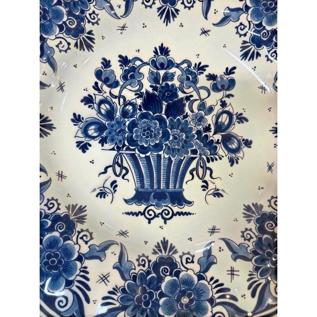 A beautiful and classic piece of Delftware. The central flower basket motif is one of the most classic and enduring...