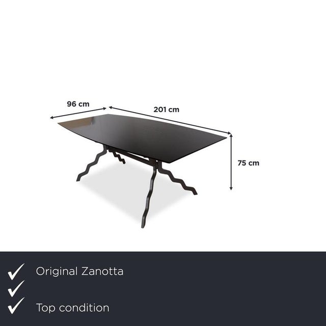 with this dining table from Zanotta, you're acquiring a piece of furniture with a sculptural, unusual frame. The curved,...