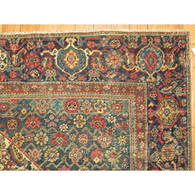 An early 20th-century wool hand knotted Persian Ferehan accent size rug