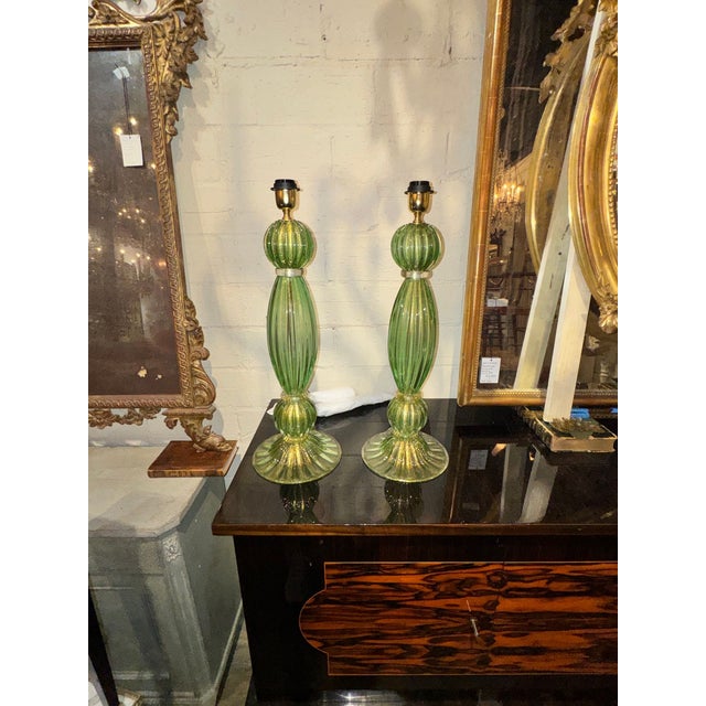 Lighting > Lamps > The product is a pair of green Murano glass lamps, perfect for adding a touch of elegance and...