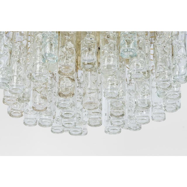 Fantastic mid-century chandelier from doria, germany, manufactured circa 1960-1969. Several murano glass cylinders...