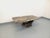 Vintage 1970s coffee table in veined marble in shades of jade green, salmon pink, black, gray, and ecru, with a V-shaped...
