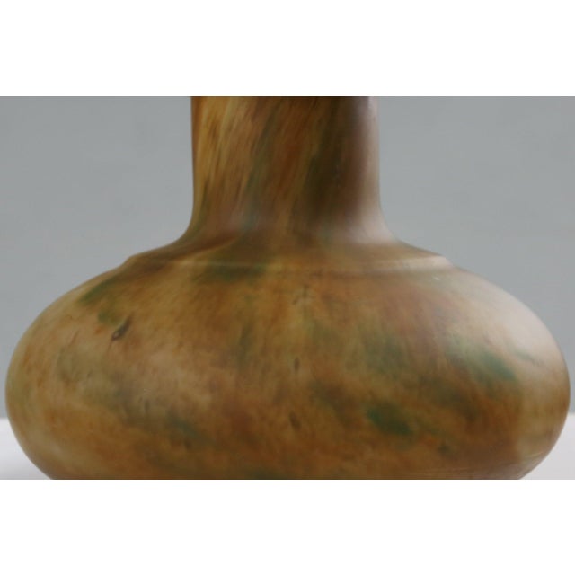 A captivating example of early 20th‑century French artistry, this glass‑paste vase beautifully bridges the fluid...