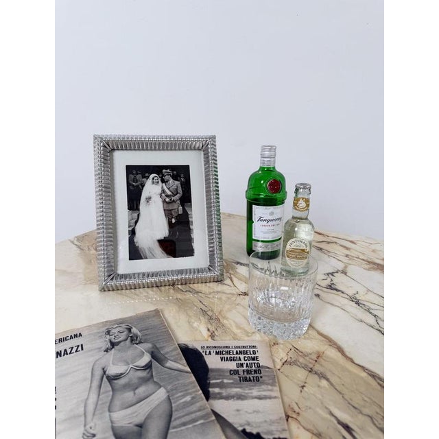 Large Italian tabletop picture frame, dating to the mid-20th century and crafted in embossed tin. Dating approximately...