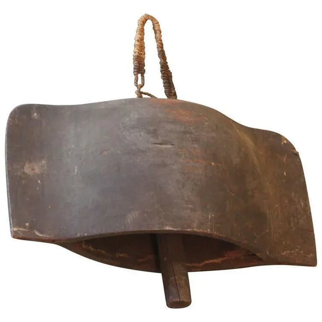 An extraordinary Rare and Unique Archaistic style huge Tibetan wood carved bell with wood clapper hanging by a woven rope...