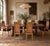 These vintage dining chairs bring texture and height to a table in equal measure. Tall cane backs are framed in warm burl...