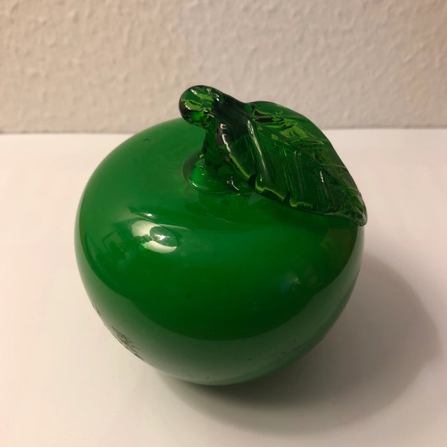 Bright green color glass apple with stem and attached leaf. Use one or more in a basket or shelf filler
