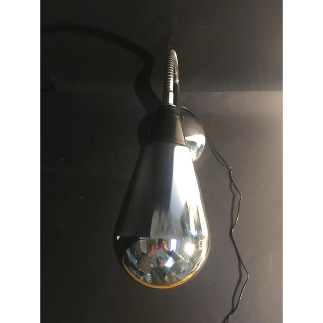 This table lamp firm was produced around 1970. It works with an E27 bulb, the structure is in chromed metal, the parts in...