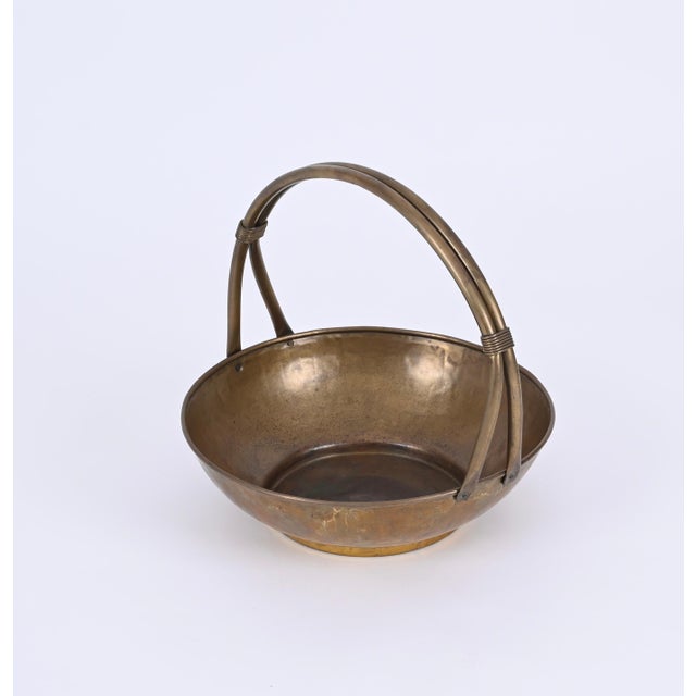Stunning basket shaped magazine rack fully made in solid brass, this lovely piece was made in Italy in the 1940s. This...