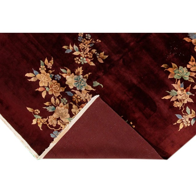 Beautiful antique Chinese Art Deco rug, a hand-knotted wool rug with a red field, and multi-color accents in an allover...