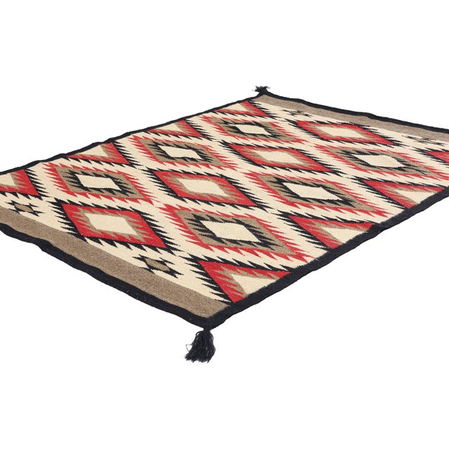 81119 Southwest Modern Eye Dazzler Navajo-Style Rug, 03'08 x 04'10. This captivating handwoven wool Southwest Modern...