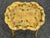 French yellow and floral mid 20th C. tray table. Heavy carved and detailed wooden "x" frame with a painted enamel finish...