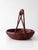 Vintage hand-woven bamboo basket featuring a wrapped handle and rich natural patina. Crafted with intricate woven detail...
