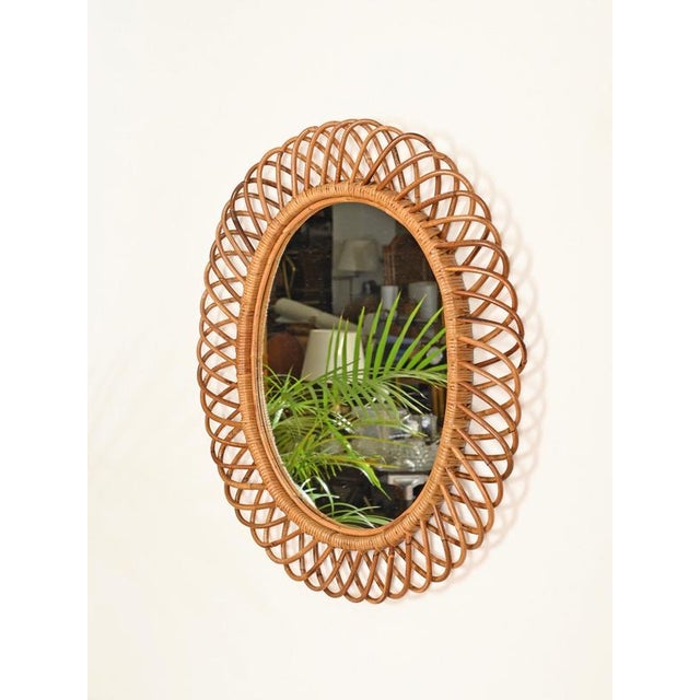 Gorgeous Mid-Century organic large oval mirror, fully handmade in bamboo, curved rattan, and hand-woven wicker. This...