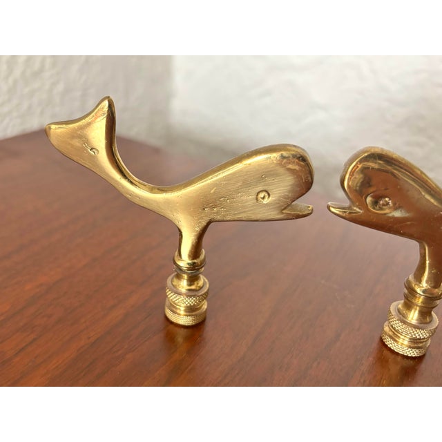 A rare brass pair of nautical whale lamp finials. Fits a standard size lamp harp. Dimensions are per finial. Please note...