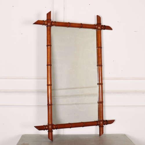 Large late 19th century French faux bamboo mirror. 1890. This piece is designed in the style of the selected designer...
