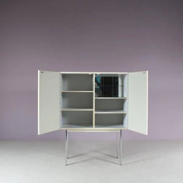 An eye-catching highboard manufactured in Belgium around 1960. Made of high quality white wood, white lacquered, with a...