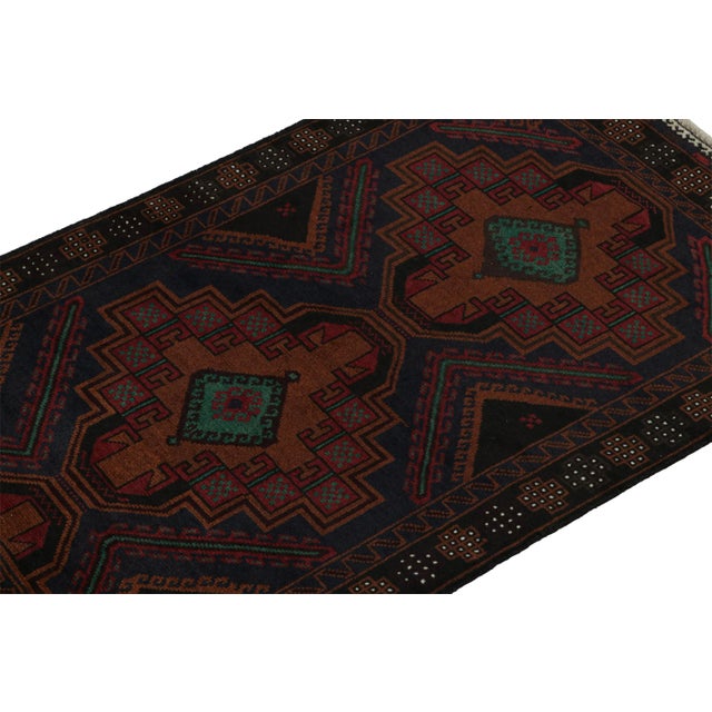 Hand knotted in wool, this 6x8 Baluch rug represents a new line of tribal carpets in the Modern Classics Collection by Rug...