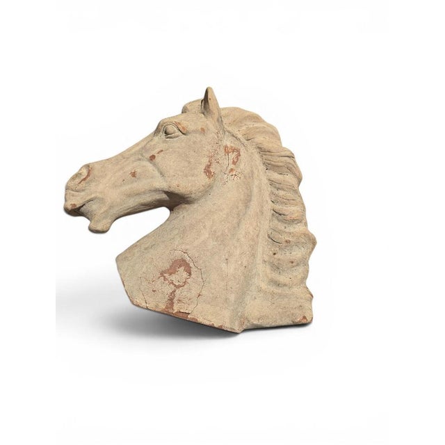 Elegant terracotta sculpture depicting the head of a Greek horse, inspired by the noble equestrian imagery of Classical...