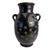 A sculptural vintage Mexican pottery vase signed “Mexico V. Silva.” Its flared rim, rounded body, and pair of loop handles...